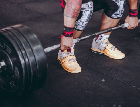 person holding the barbell